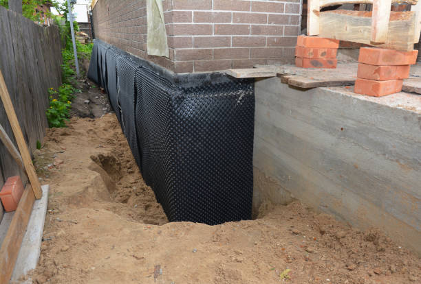 SJ Waterproofing Pros technician performing targeted Sump Pump Installation assessment in York, NY